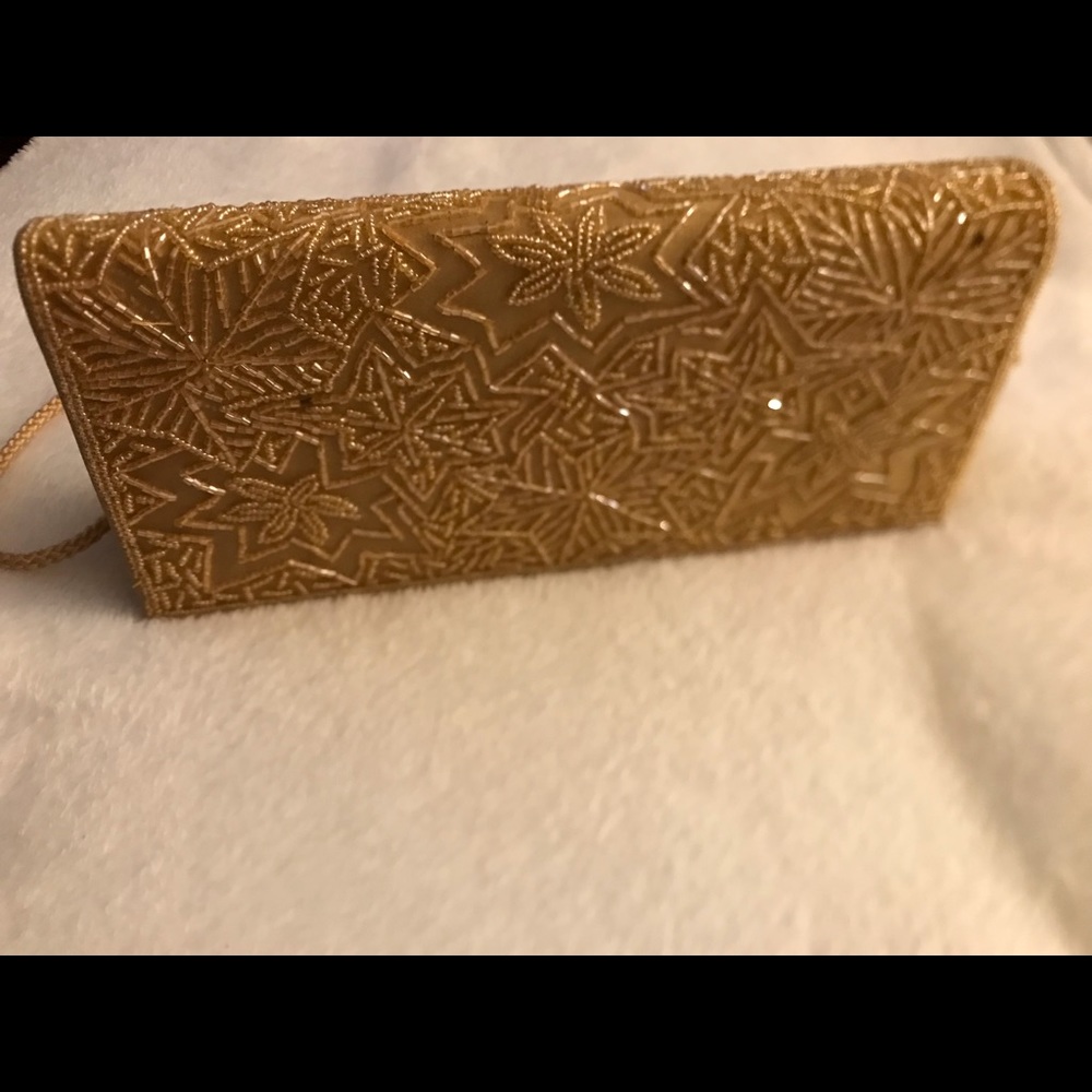 beautiful gold colored mini bag with two handles